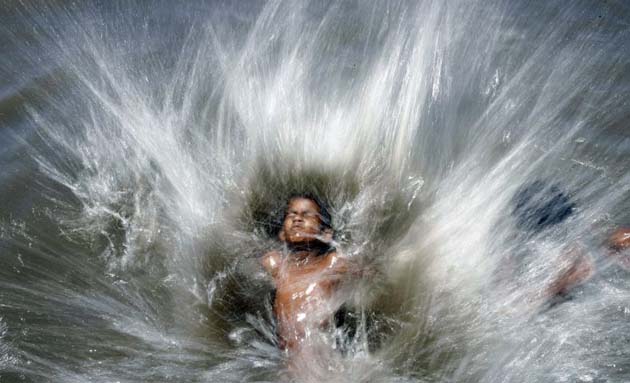 An Indian child in water