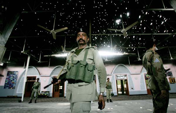 Red Mosque bullet riddled roof, Pakistani soldiers