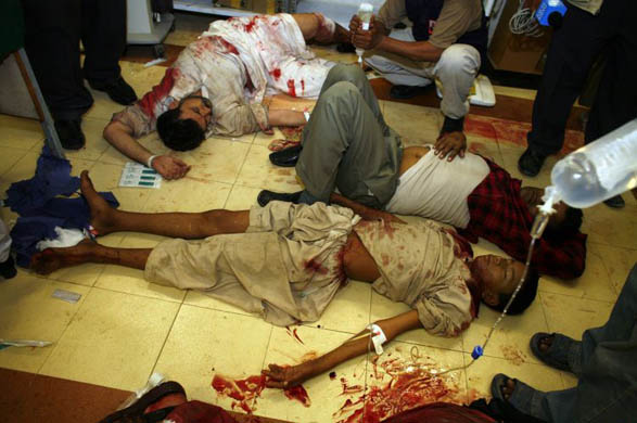 Injured men on the floor of a Karachi hospital