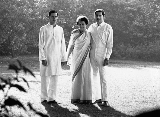 Indira Gandhi stands with her two ...