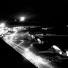 A night shot of a line of U.S. Air Force C-47 transport planes unload milk at Tempelhof airport