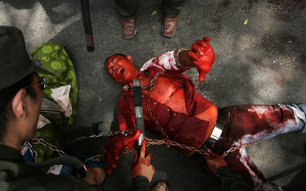New Delhi, India: Tibetan exiles perform a skit in a street depicting the alleged atrocities of the Chinese authorities on the Tibetan people