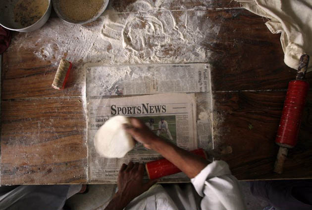 A local baker makes dough for chapati 