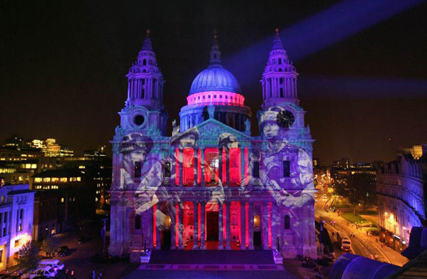 London, UK: An image of soldiers is projected onto St Paul's Cathedral after the City Salute sunset pageant