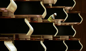 A construction worker stands in a box in the newly refurbished Royal Festival Hall 