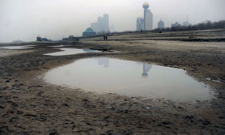 A river bed is exposed as water levels fall along the Yangtze river near Wuhan, central China's Hubei province
