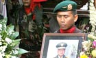 Soldiers process with coffin
