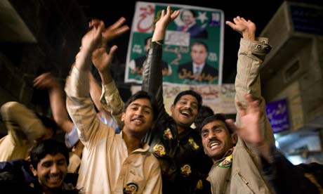 Supporters of Pakistan's former prime minister Nawaz Sharif celebrate early results in Pakistan's general elections in Lahore