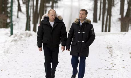 Vladimir Putin and Dmitry Medvedev on a stroll near Moscow. Photograph: Alexander Zemlianichenko/EPA