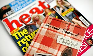 Anne Frank, The Diary of a Young Girl with a copy of Heat magazine.