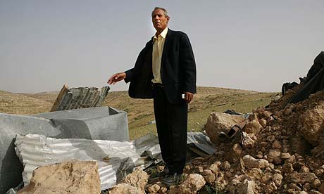 Aqil al-Talalqah, from the Bedouin village of al Twayil Abu Jarwal, stands among the rubble of homes demolished by the Israeli authorities in the Negev near the southern Israeli city of Beer Sheva