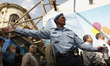 A UN officer directs Cypriots in Nicosia