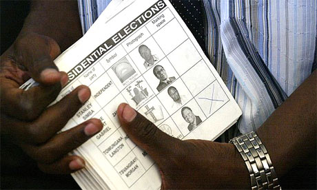 A Zimbabwe polling agent holds voting papers during a recount