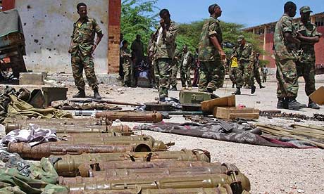 Ethiopian soldiers in Mogadishu, Somalia, guard a cache of ammunitions they said were used by insurgents during two days of heavy fighting