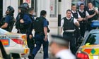Armed police officers on the scene after gun shots are heard in Markham Square, Chelsea