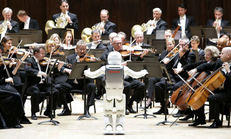 Honda's Asimo robot conducts the Detroit Symphony Orchestra. 