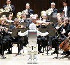 Honda's Asimo robot conducts the Detroit Symphony Orchestra. 