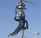 A man flies what is claimed to be the world's smallest one-man helicopter