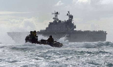 USS Peleliu accompanied by an amphibious launch