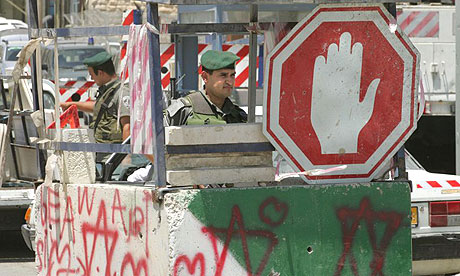 Israeli border guards man the Anata checkpoint between Jerusalem and the West Bank