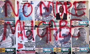Zimbabwe election posters of Robert Mugabe covered in opposition slogans