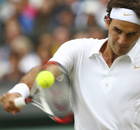 Roger Federer plays a backhand shot at Wimbledon 2008