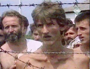 A still image from video footage showing emaciated prisoners at the Trnopolje concentration camp in Bosnia in the summer of 1992