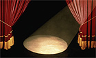 Theatre spotlight, stage and curtains