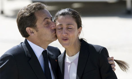 France's President Nicolas Sarkozy kisses freed French-Colombian hostage Ingrid Betancourt on arrival at Villacoublay military airport in Paris. Betancourt and 14 others were rescued on Wednesday. 