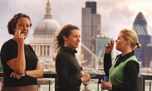 Like these women at British American Tobacco, smokers will have to light up outside when the smoking ban comes into effect on Sunday. Photograph: John Stillwell/PA.