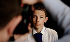 George Plemper takes a photograph of a pupil at the academy that was once the school at which he taught