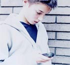 Teenager using mobile phone