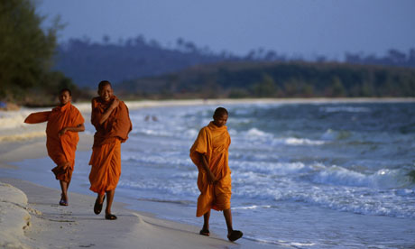Cambodian monks on a beach