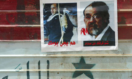 Images of Iraqi prime minister Nouri al-Maliki with a noose around his neck and half his face metamorphosing into Saddam Hussein in Sadr City